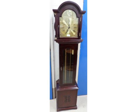A reproduction mahogany longcase clock with triple weight chiming movement