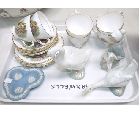 A Vale Royal 18 piece tea set with country cottages; a Lladro boy with lamb; 2 Nao geese; a Wedgwood dish