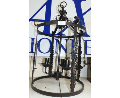 A wrought metal 5-sconce hanging lantern