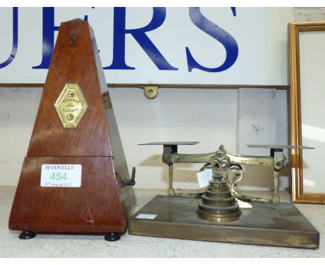 Mahogany cased metronome; a set of brass postage scales 