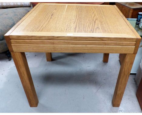 A modern light oak extending dining table with 2 chairs