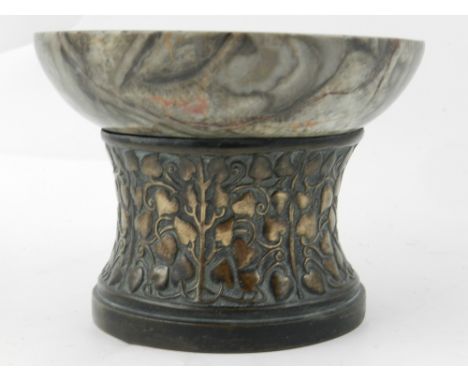 In the Arts and Crafts style, a marble dish on a bronze base, having scrolling leaf shaped decoration H.9.5cm D.13cm