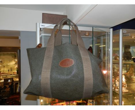 A Mulberry brown Scotch grain leather travel bag, having Mulberry tree fabric lined interior. 