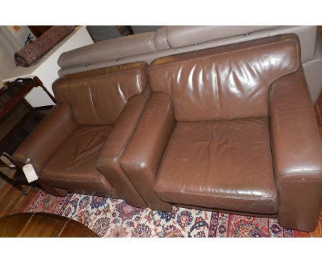A pair of Art Deco style brown leather 'Cube' armchairs.