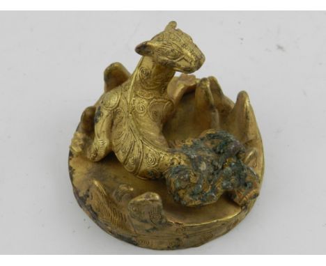 An unusual Chinese bronze study of a creature, having stylised engravings.  D.6cm