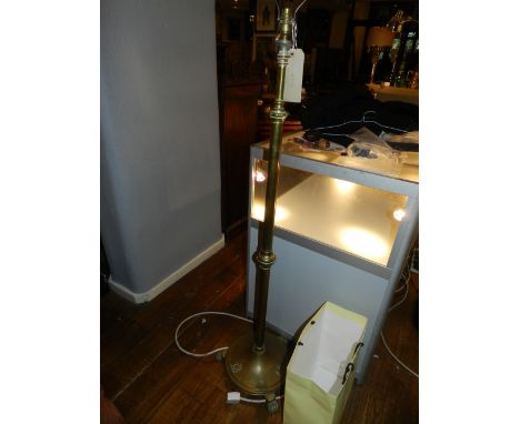An early 20th century brass telescopic adjustable standard lamp
