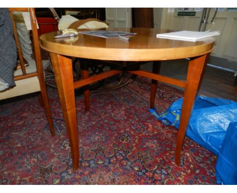 A Southern-German Art Deco period walnut centre table, raised on squared tapered splayed legs united by an X-stretcher H.73cm