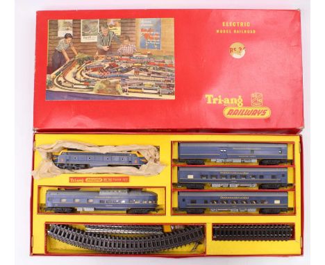 Triang RMS34 Electric Model Railroad comprising double ended blue/yellow diesel loco, and four TC cars blue. Track is rusty. 