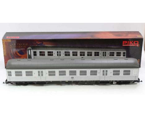 A Piko 37620 G scale 45mm silver second-class mainline bogie DB coach. Model features two buffers at each end, warning lights