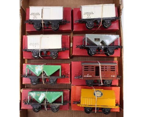 Eight post-war Hornby 0-gauge 4-wheel wagons: Cement, yellow; BR cattle, brown; BR hopper, grey; two LMS hopper, green; three