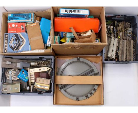 Eight boxes containing a large collection of mixed Marklin HO scale track, lineside accessories, points, etc, to include vari