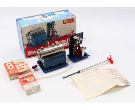 A Wilesco D52 marine steam engine housed in the original card box, comprising of boiler, burner, engine and a quantity of sol
