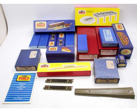 A large box of Hornby-Dublo accessories and a few points: 5005 Engine Shed kit plain red box; 5006 Extension kit for Engine S