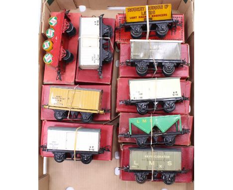Nine Hornby 0-gauge wagons: pre-war: LMS Banana; LMS refrigerator (roof repainted), grey; Robert Hudson side tipping, yellow;