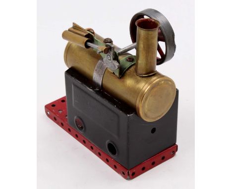 A Mamod and later restored horizontal steam plant comprising of tin housed boiler with filler cap and single cylinder engine,