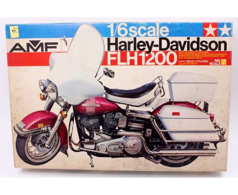 A Tamiya 1/6th scale Harley Davidson FLH 1200 Motorcycle model kit, set appears to be complete, with the majority of parts ba