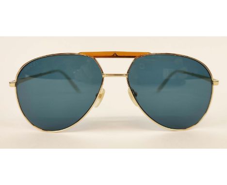 GUCCI SUNGLASSES, gold tone and mother of pearl style arms, with amber coloured front detailing, with case and pouch. 