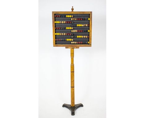 ABACUS, 146cm H x 51cm W, 19th century ash and polychrome with iron base. 