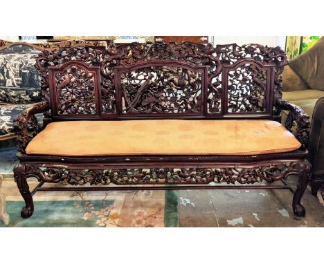 CHINESE SOFA, 176cm W x 103cm H, rosewood heavily carved all over with bird and floral detail. 