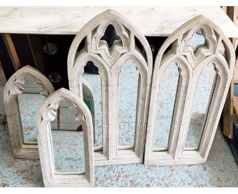 ARCHITECTURAL WALL MIRRORS, two graduated pairs, 85.5cm x 36.5cm at largest, composite stone frames, Gothic style design. (4)