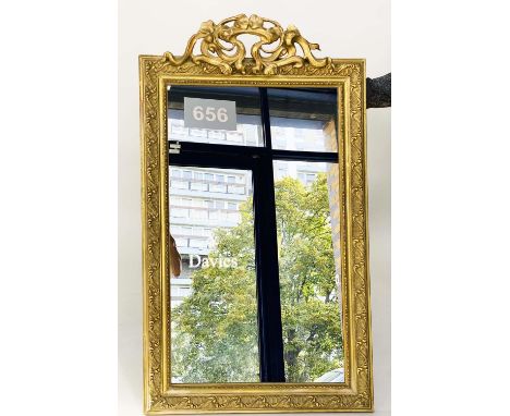 WALL MIRROR, early 20th century French Art Nouveau/Belle Epoque giltwood and gesso with foliate crest and beaded frame. 118cm