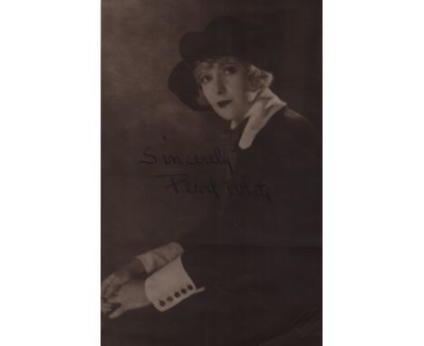 WHITE PEARL: (1889-1938) American Silent Film Actress. Rare vintage signed sepia 5 x 8 photograph of White seated in a half l