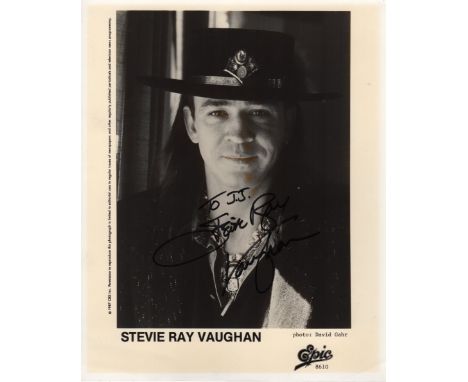 VAUGHAN STEVIE RAY: (1954-1990) American Blues and Rock Guitarist. Signed and inscribed 8 x 10 photograph of Vaughan in a hea
