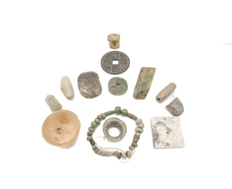 A Chinese stone cup, with calligraphy, height 3.9cm, a Japanese cast coin, archaic jade and other items.