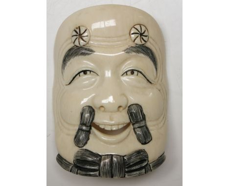A Japanese ivory noh mask netsuke, Meiji Period, signed, 8.5 x 6cm.