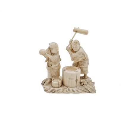 A Japanese carved ivory okimono group of a couple pounding dough, Meiji period, signed, height 12cm, width 11.5cm, depth 7cm.