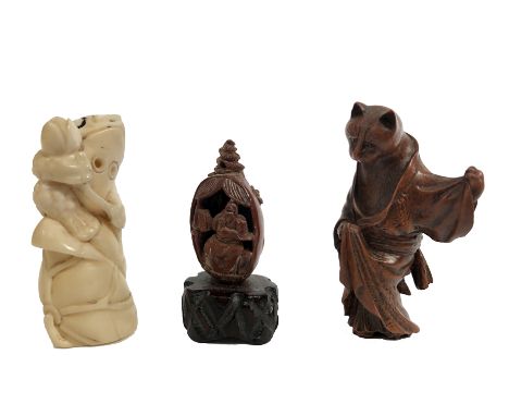 A Japanese ivory netsuke of a frog holding a lotus flower, circa 1900-1920, height 5.5cm, a netsuke with initials P.M.S to ba