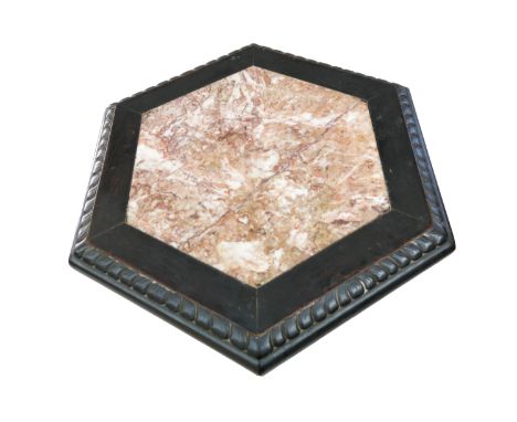 An Chinese ebonised jardiniere stand, 19th century, with an hexagonal marble inset top, on a  dragon and floral carved stem a