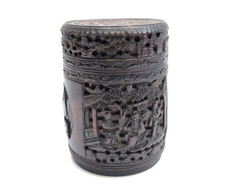 A Chinese carved bamboo cylindrical tea caddy, 19th century, with panels enclosing figures beneath trees and phoenix, signed,