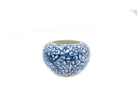 A Chinese blue and white porcelain brushwasher, Qianlong mark, with repeat scroll design and two stylised dragons, height 6.5