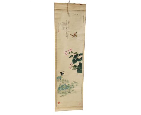 A Chinese painted scroll, early 20th century, with butterflies, plants and calligraphy, length 127.5cm, width 35.5cm.