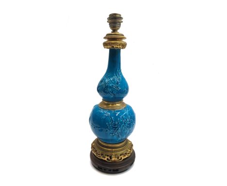 A Chinese pottery double gourd shaped vase lamp, late 19th century, the turquoise ground moulded with phoenix and a flowering