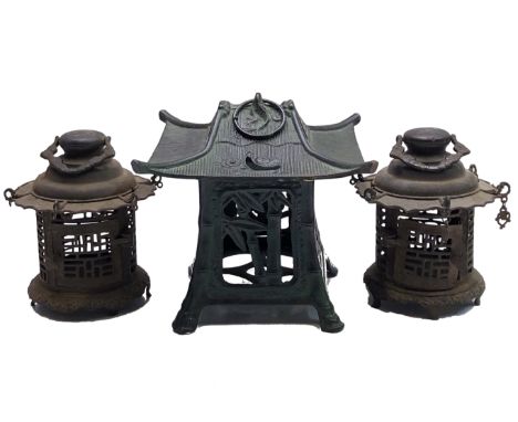 A Japanese hanging iron lantern, height 21cm, width 22.3cm and a pair of cylindrical lanterns, height 18cm, diameter 16cm.