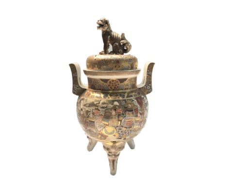 A Japanese Satsuma pottery koro and cover, late 19th century, with temple dog finial, twin lug handles, gilt decorated with S