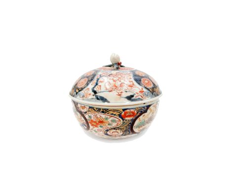 A Japanese Imari tureen, 18th century, the cover with a fruit finial and decorated with ducks and foliage, the base with bamb