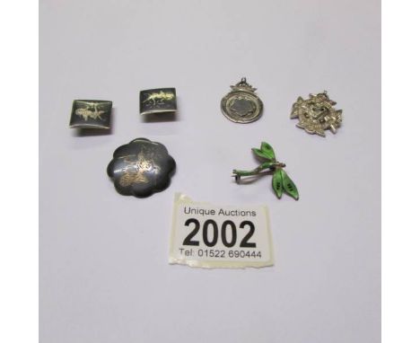2 silver fobs, a silver Siam brooch, a pair of silver Siam cuff links and a silver and enamel dragonfly brooch (some damage t