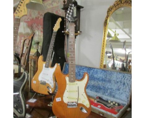 A 'Hamer' Strat copy electric guitar with tremelo arm.