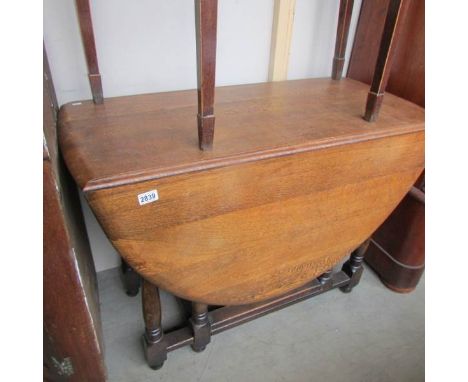 An oak gate leg table.