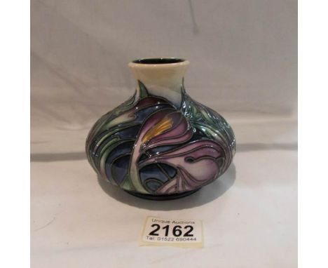 A Moorcroft squat vase, approximately 4.25" tall.