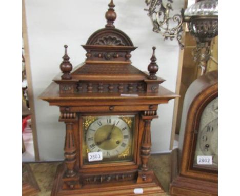 An oak cased bracket clock.
