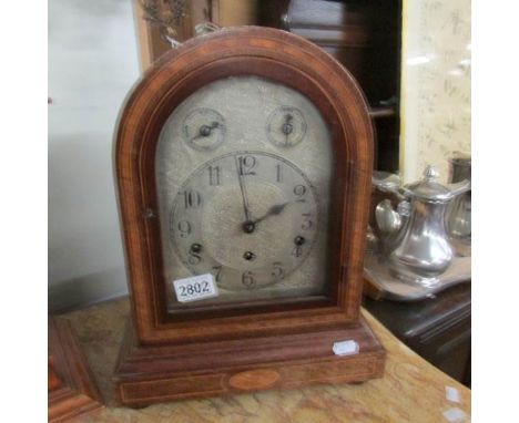 A Westminster chime mantel clock.
