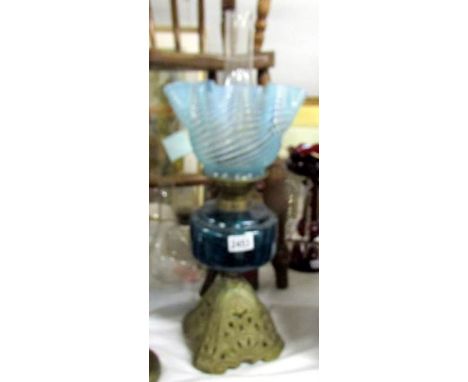 A good Victorian oil lamp with blue glass font and original Victorian shade, in good condition.