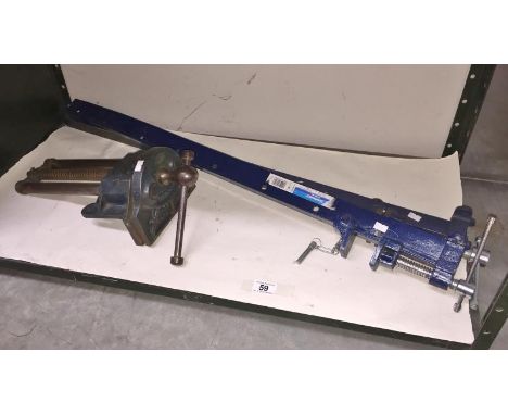 A bench vice and a pair of bar sash clamps