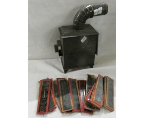 A Child's magic lantern projector with slides.