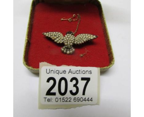 A commission made owl brooch. Made in 1939 by Hatton Garden Jeweller Bernard Coulter. Diamond set eyebrows, ruby eyes with se