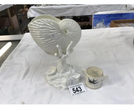 A Royal Worcester Blanc de Chine nautilus shell &amp; a miniature Royal Worcester loving cup